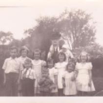 Girls from left to right: Kathleen Main, Dorothy Main, Jeanne Murphy, Joan McAloon, Maureen Murphy and Nancy McAloon Boys: Joseph McAloon, Daniel McAloon (?) and ? with Annie Flangheddy McAloon